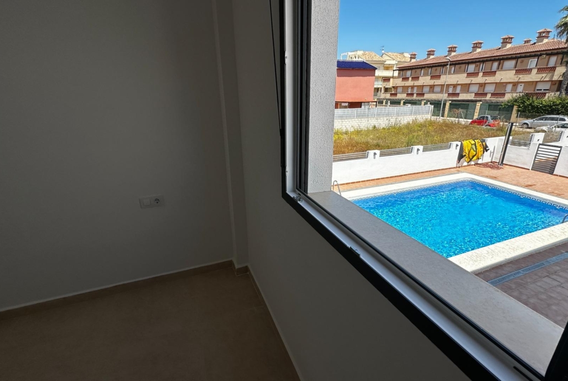 Exclusive townhouses in Oliva Nova: style, comfort, and sea just 500 m away