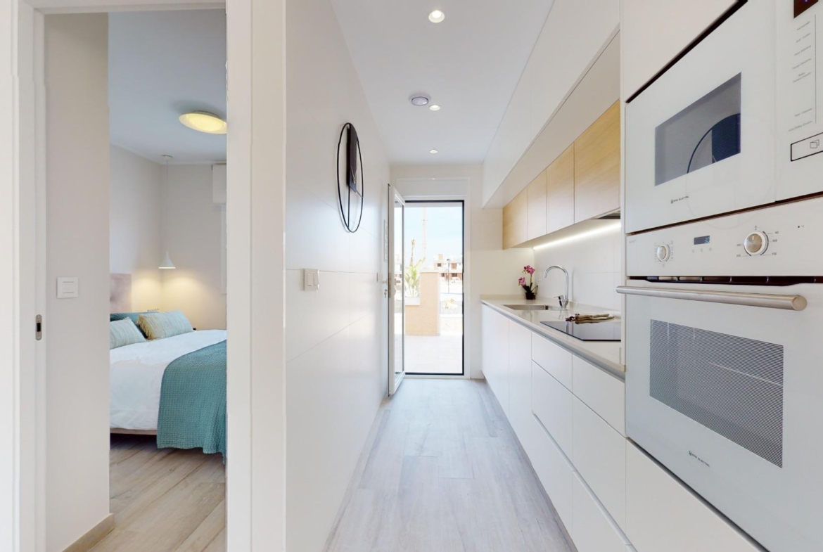 ADOSADOS DE OBRA NUEVA EN PILAR DE LA HORADADA. 3 DORM. 2 BAÑOS. CON PLAZA DE GARAJE Y PISCINA. 83 M2. JARDIN 33 M2. SOLARIUM 34 M2.