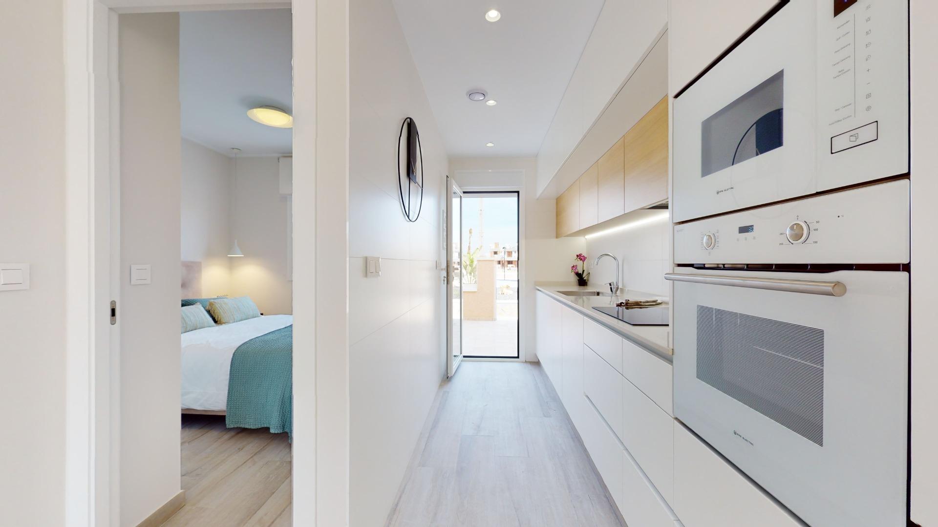 4-40-20 ADOSADOS DE OBRA NUEVA EN PILAR DE LA HORADADA. 3 DORM. 2 BAÑOS. CON PLAZA DE GARAJE Y PISCINA. 83 M2. JARDIN 33 M2. SOLARIUM 34 M2.