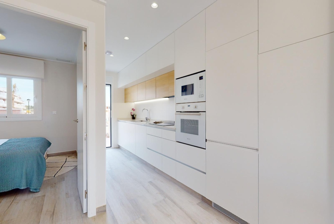 ADOSADOS DE OBRA NUEVA EN PILAR DE LA HORADADA. 3 DORM. 2 BAÑOS. CON PLAZA DE GARAJE Y PISCINA. 83 M2. JARDIN 33 M2. SOLARIUM 34 M2.
