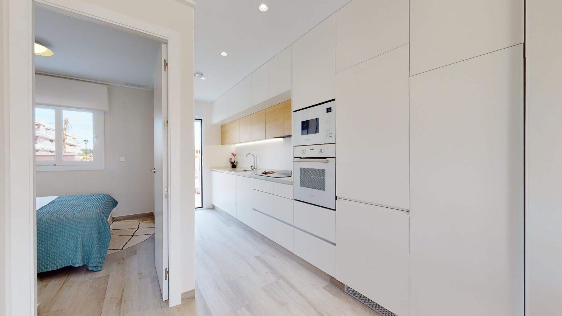 4-42-17 ADOSADOS DE OBRA NUEVA EN PILAR DE LA HORADADA. 3 DORM. 2 BAÑOS. CON PLAZA DE GARAJE Y PISCINA. 83 M2. JARDIN 33 M2. SOLARIUM 34 M2.
